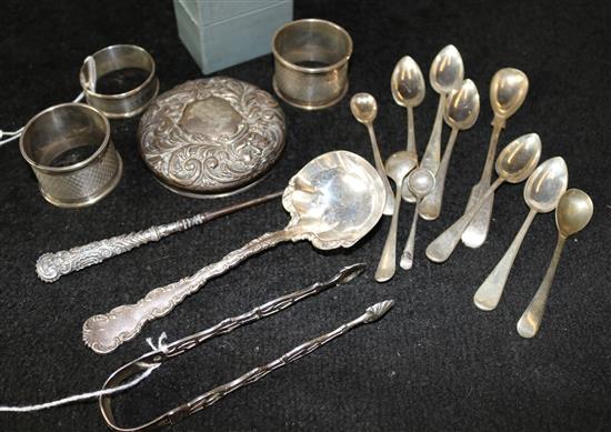 Four silver napkin rings (one boxed), a small quantity of Georgian & later silver spoons, sugar tongs & sundry items